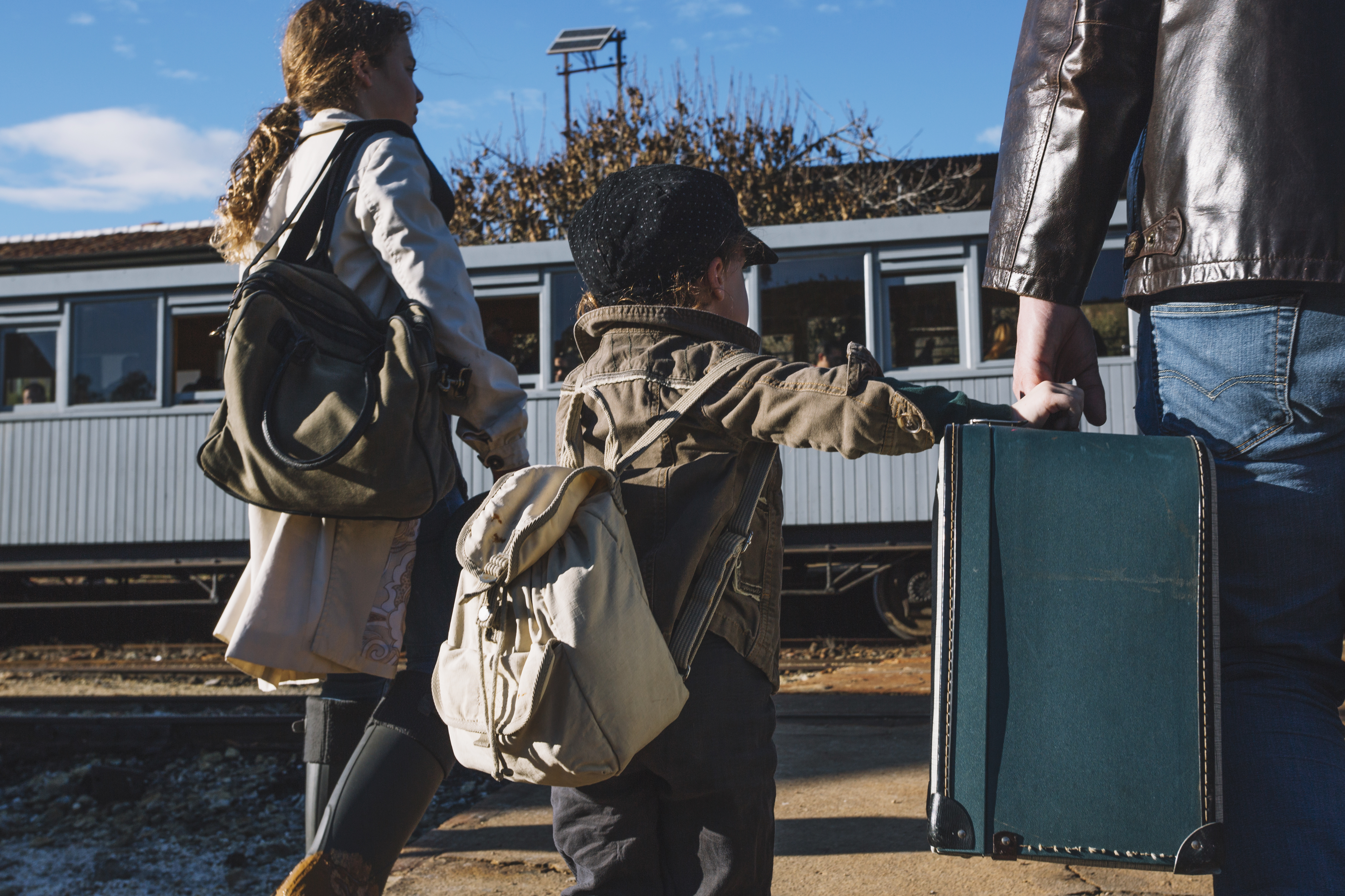 refugee family at the station